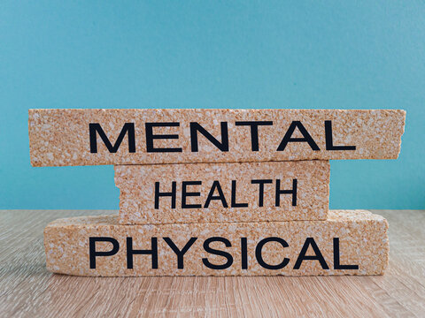 Mental or physical health symbol on brick blocks. Changes words physical health to mental health. Beautiful blue background, copy space. Medical and mental or physical health concept.