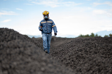 Workers at a coal-processing plant