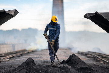 Workers at a coal-processing plant