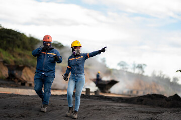 Workers at a coal-processing plant