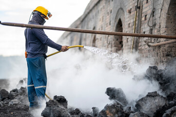 Workers at a coal-processing plant