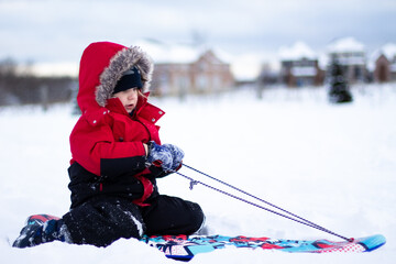 little child playing in snow