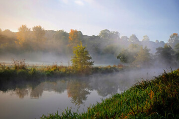 Naklejka na ściany i meble Mist over the meadows of the River Wey, Guildford, Surrey, UK