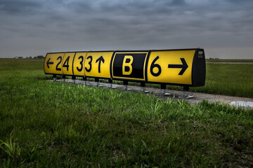 Airport taxi and runway sign