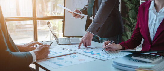 Team of businesspeople working with chart of accounts (COA) and balance sheet, stock market data, consulting asset accounts record any resources of company, anti bribery, error checking concept