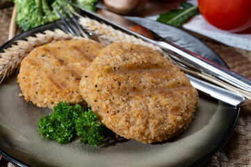 Source of fibre plant based vegan wheat protein grilled burgers, meat free healthy food close up