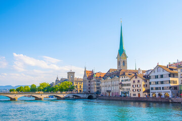 Naklejka na ściany i meble Scenic panoramic view of historic Zürich city center with famous Fraumünster and Grossmünster Church and river Limmat at Lake Zurich on a beautiful sunny day with blue sky in summer, Switzerland