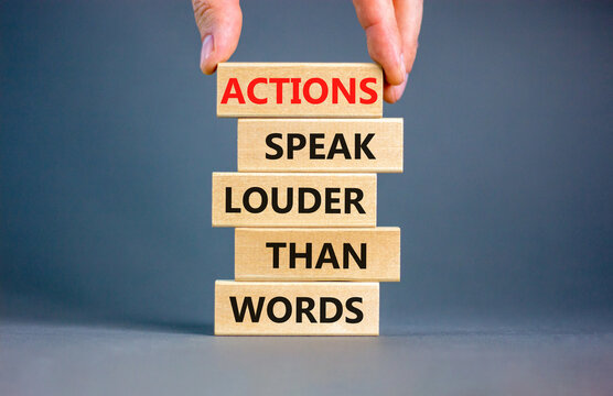 Actions speak louder words symbol. Concept words Actions speak louder than words on wooden blocks. Beautiful grey table grey background. Business new mindset for results concept. Copy space.