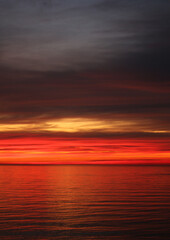 Photo of a bright red sunset on the Black Sea - 565962512