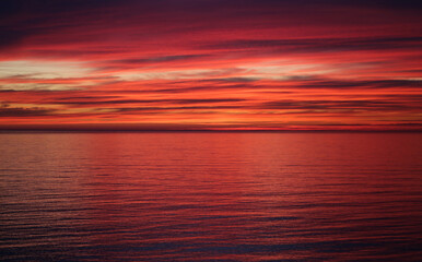Photo of a bright red sunset on the Black Sea - 565962521