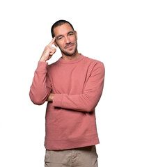 Happy young man doing a gesture of concentration