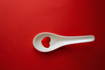 Red Heart shape in white spoon