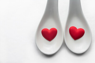 Red Heart shape in white spoon with copy space for text and design