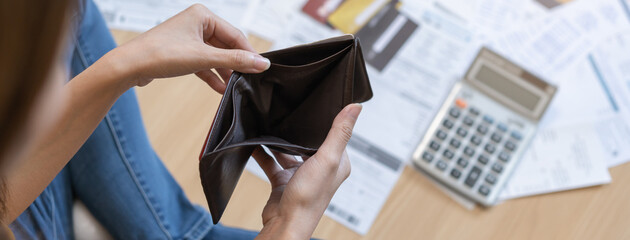 Stressed, problem people asian woman, girl sitting on floor at home, hand holding wallet open empty...