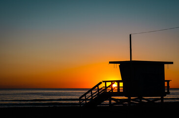 lifeguard tower at sunset
