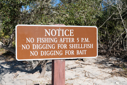 Warning sign - no fishing, no digging for shellfish or bait at the beach