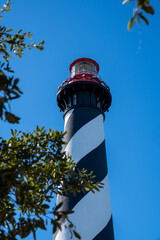 The famous St. Augustine Lighthouse against a bright blue sunny Florida sky