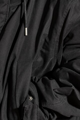 Fototapeta premium Unrecognizable man in black jacket. Extreme close-up.