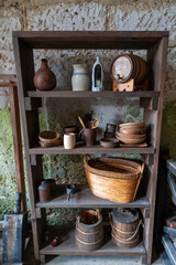Fototapeta na wymiar Old kitchen artifacts on a shelf at Castillo de San Marcos National Monument fort