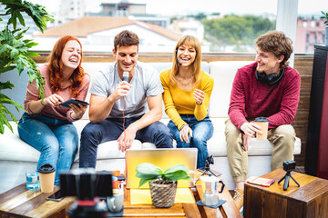 Happy young friends startupper having fun on streaming platform - Content marketing concept with millenial guys and girls sharing live vlog feed on social media channel networks - Bright vivid filter