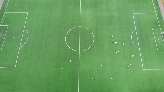 Top view of the football field, amateur adult teams are playing: Gomel, Belarus - May 2021
