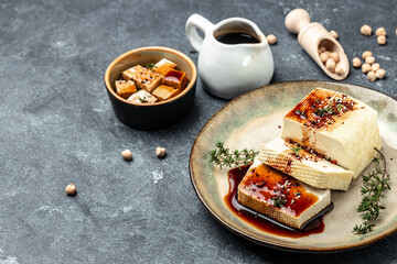 healthy vegan asian meal tofu with soy sauce topping, Clean eating, dieting, vegan food concept. top view