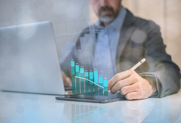 Businessman analysing budget of business market. Financial performance, revenue and costs concept.