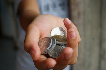 Stock photo of someone who is making a monetary donation