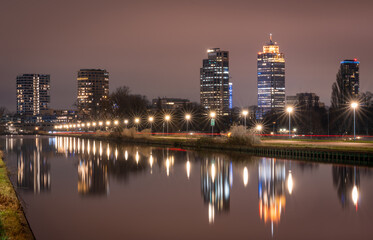 Cityscape of Amsterdam in the evening, view of skyscrapers at Omval neighbourhood and Weespertrekvaart canal