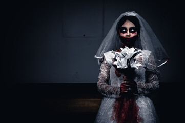 Halloween festival concept,Asian woman makeup ghost face,Bride zombie charactor,Horror movie...