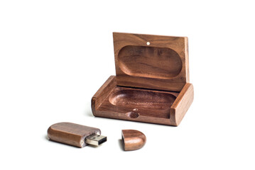 Small packaging for USB-drive from light wood. Wooden box with USB-storage for a photographer, on a white isolated background. Copy space