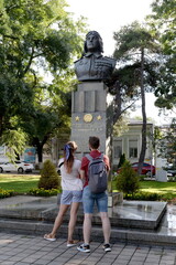 Obraz premium People at the bust of twice Hero of the Soviet Union Aviation Lieutenant General Yevgeny Savitsky in the hero city of Novorossiysk