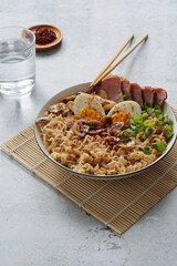 A bowl with ramen, an Asian noodle soup