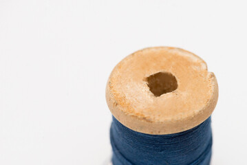 Wooden coil on white background, thread, isolate