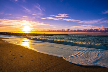 Beautiful sunset on the beach and sea with waves, Denmark