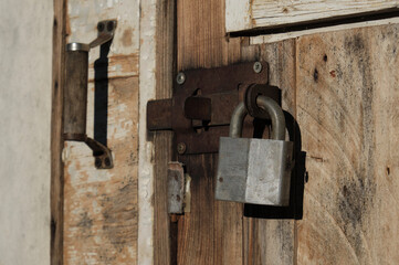 padlock on an old wooden door