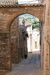 Old narrow alley in Spello, Umbria Italy