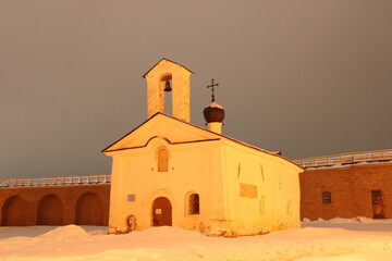 Old stone church of the snow at winter night 