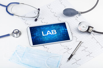 Close-up view of a tablet pc with medical abbreviation