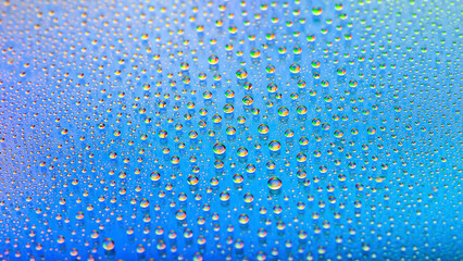 Water drops. Abstract gradient backdrop. Texture of the drops. Blue gradient. Heavily textured image. Shallow depth of field. Selective focus