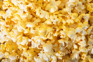 Group of extra buttered popcorn. It is a perfect background for film and television