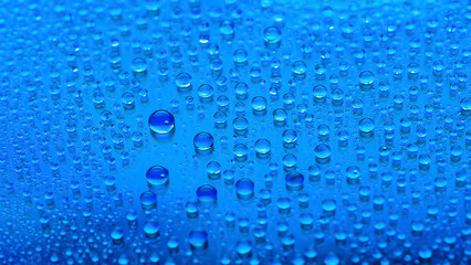 Water drops. Abstract gradient background. Droplet texture. Light blue gradient. Heavily textured image. Shallow depth of field. Selective focus