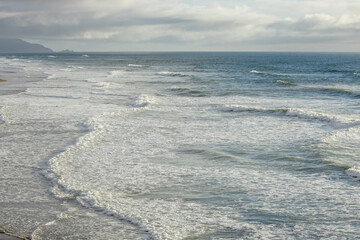 Sea ripples and waves on a Pacific coast beach, California, USA