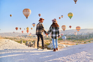 Couple travelers vacations together in beautiful destination in Goreme, Turkey. Fabulous Kapadokya...