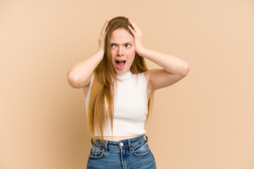 Young redhead woman cut out isolated covering ears with hands trying not to hear too loud sound.