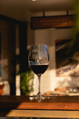 Red wine glass in a restaurant fine dining during sunset evening dinner
