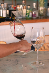 Red wine glass in a restaurant fine dining during sunset evening dinner