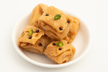 Indian Bengali Mithai Laung Latta Also Called Lavang Lata Long Latika Made Of Cloves Ghee And Stuffed With Mawa Khoya Chasni Mava Khoa Is Enjoyed On Deepawali, Teez, Rakhi Holi, Rakshabandhan And Teej