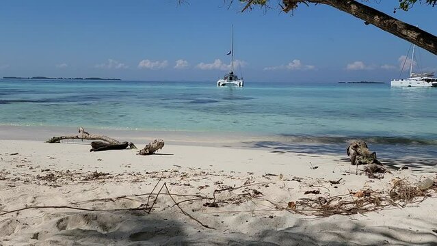 Boat Anchored Off A Beach