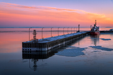 Canadian Coast Guard Ship Martha L Black docked at the Baie-Comeau wharf at sunset.